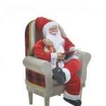 Babbo Natale sulla Poltrona con Quaderno e Orsacchiotto