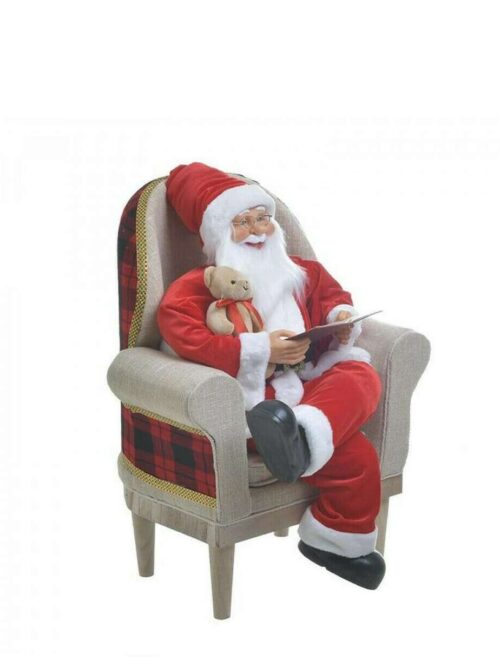 Babbo Natale sulla Poltrona con Quaderno e Orsacchiotto