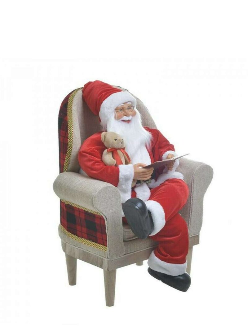 Babbo Natale Sulla Poltrona Con Quaderno E Orsacchiotto